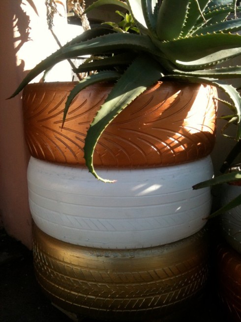 Metallic tyre flower pot by Riaan Chambers